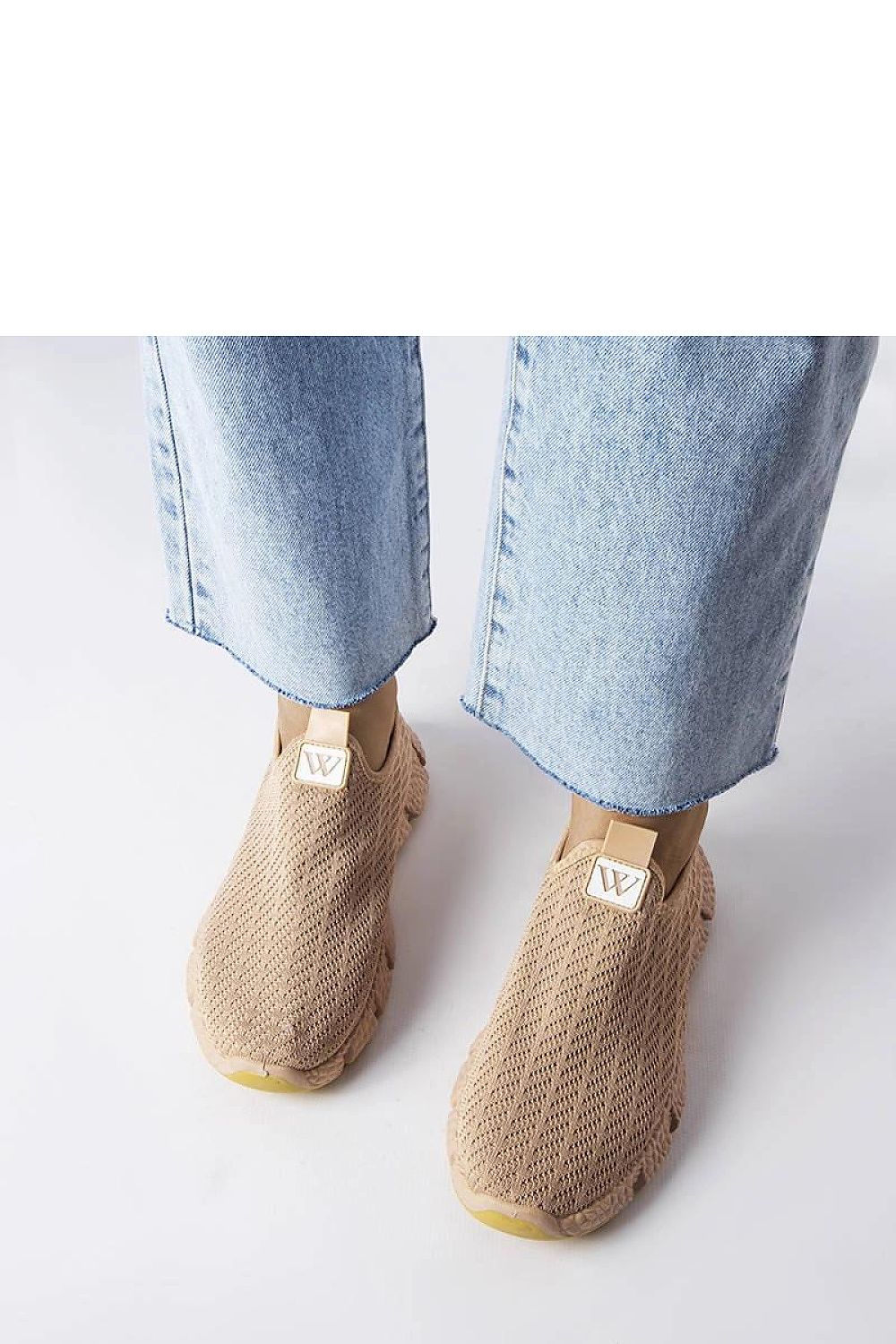 beige sport shoes detail view