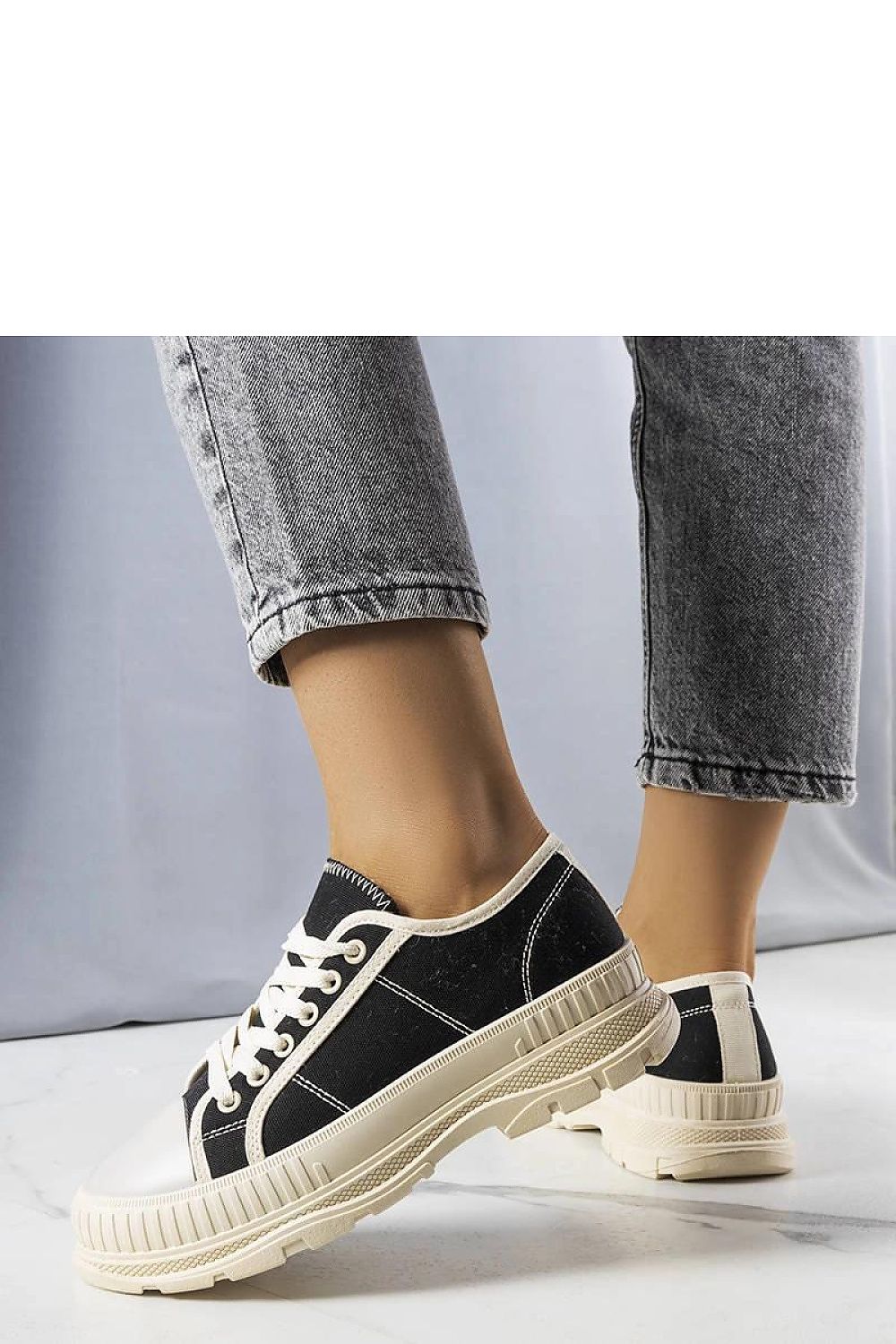 black lace sneakers detail view