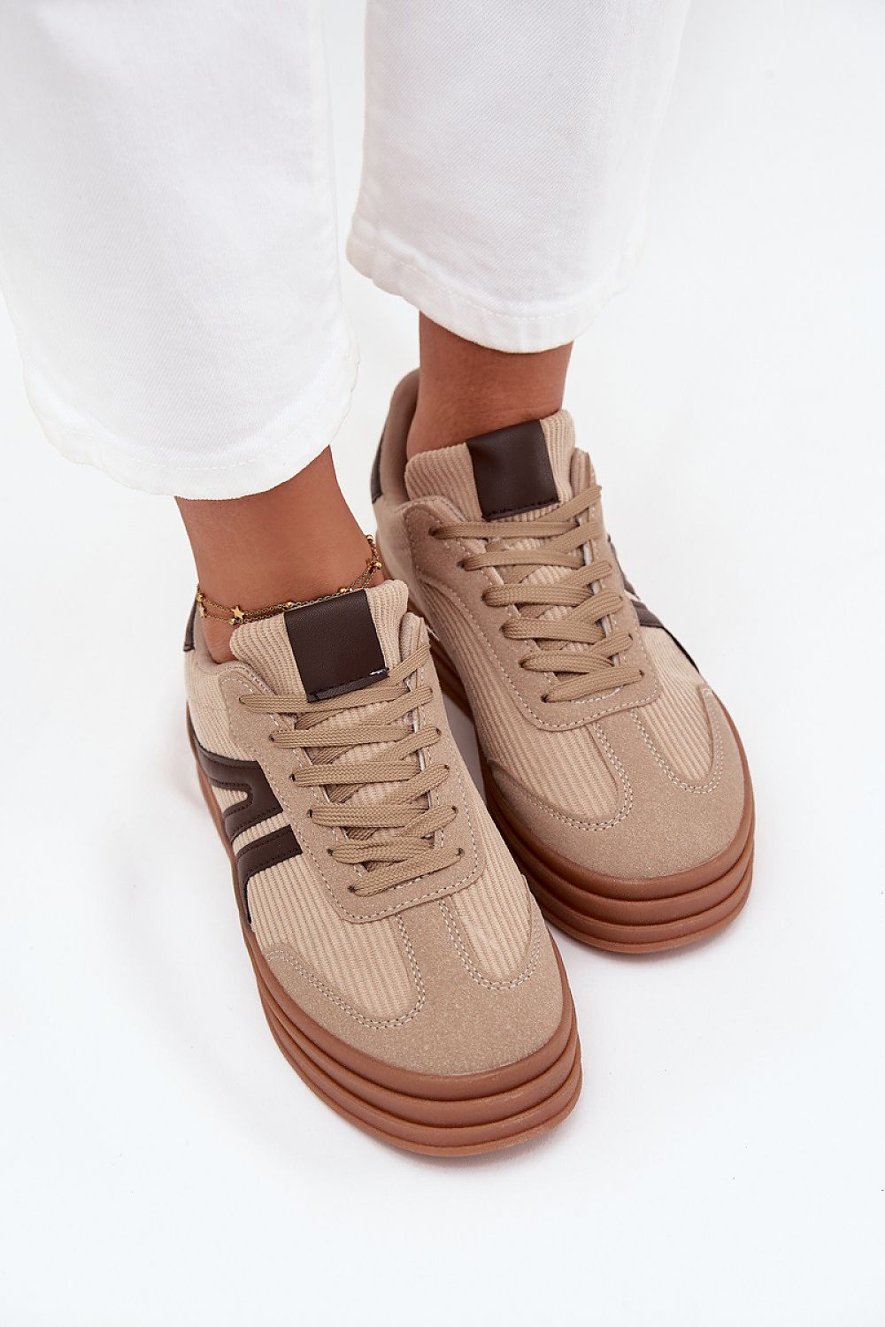 beige sport shoes detail view