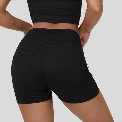 Back-facing model in light blue yoga shorts

