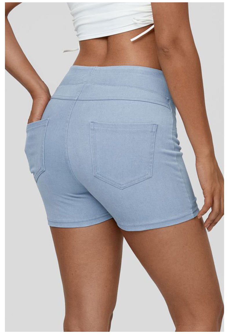 Back angle of high waisted denim yoga shorts for women

