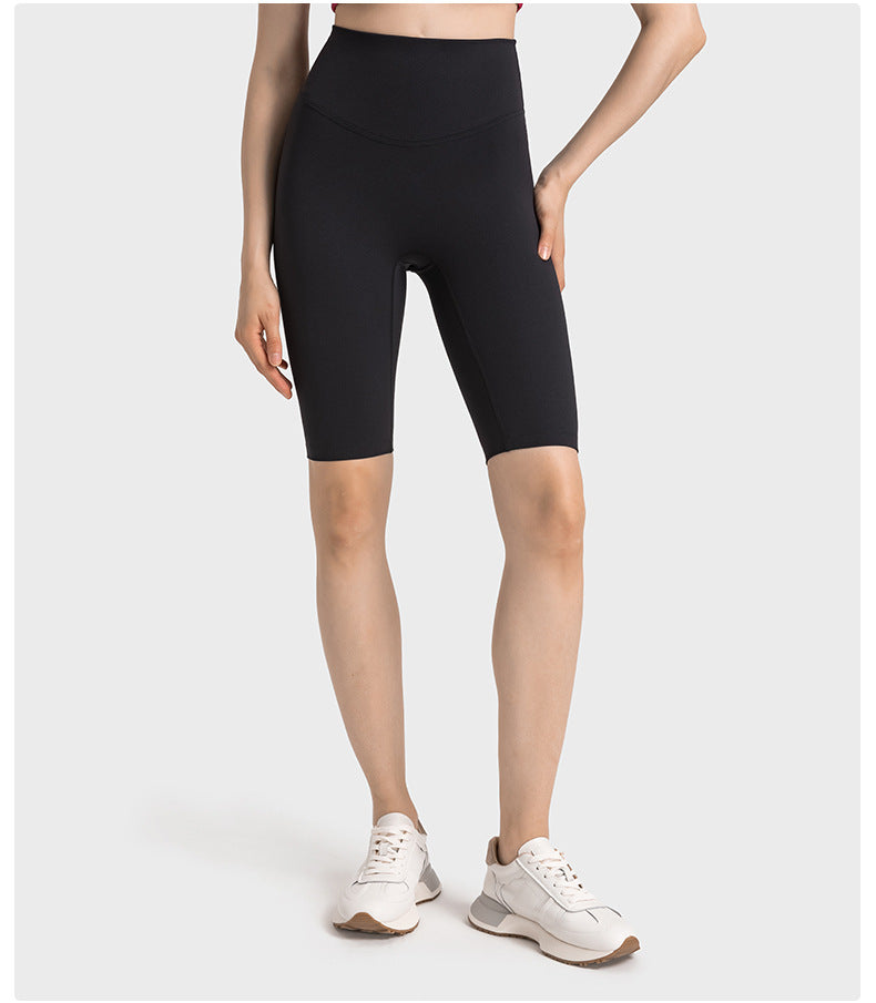 Front view of black high-waisted yoga pants on model