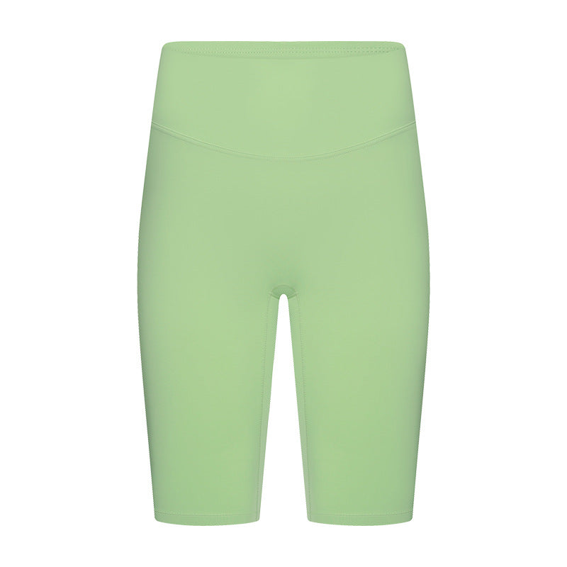 Front view of lemon yoga shorts on model