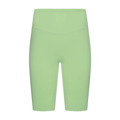 Front view of lemon yoga shorts on model