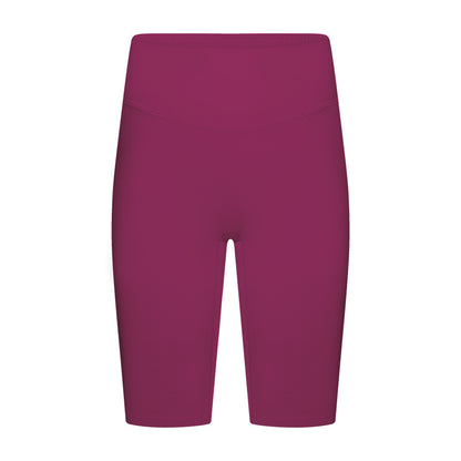 Front view of pink yoga shorts on model