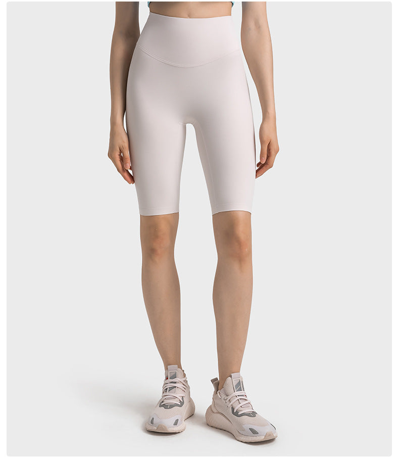 Front view of white high-waisted yoga pants on model