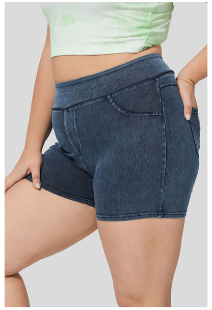 Side profile of plus size denim yoga shorts with pockets

