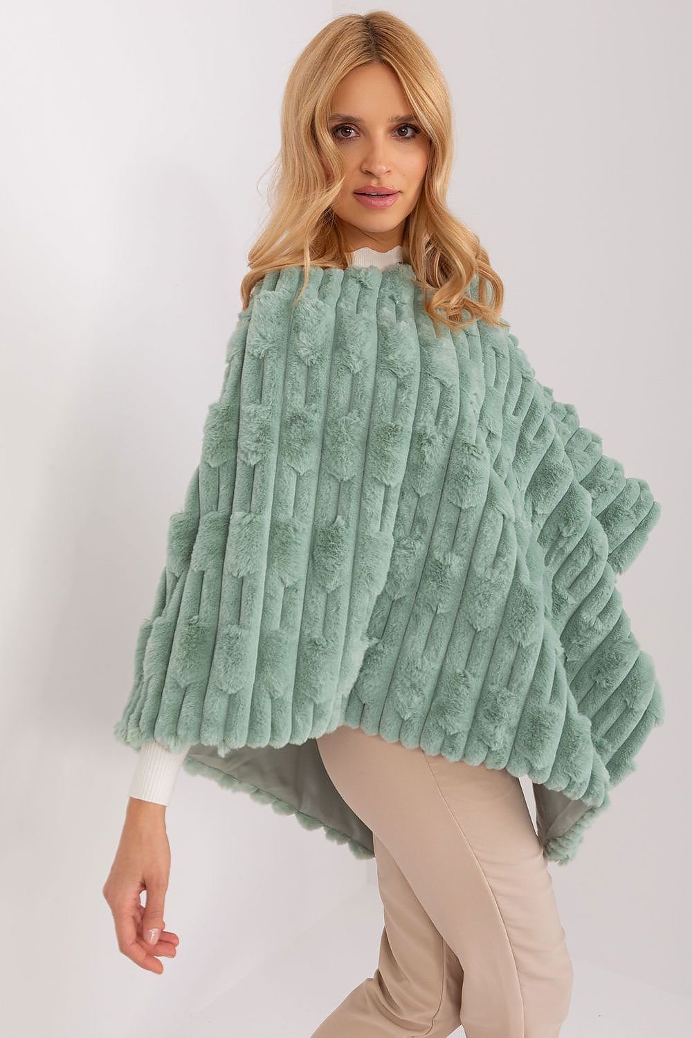 green poncho detail view