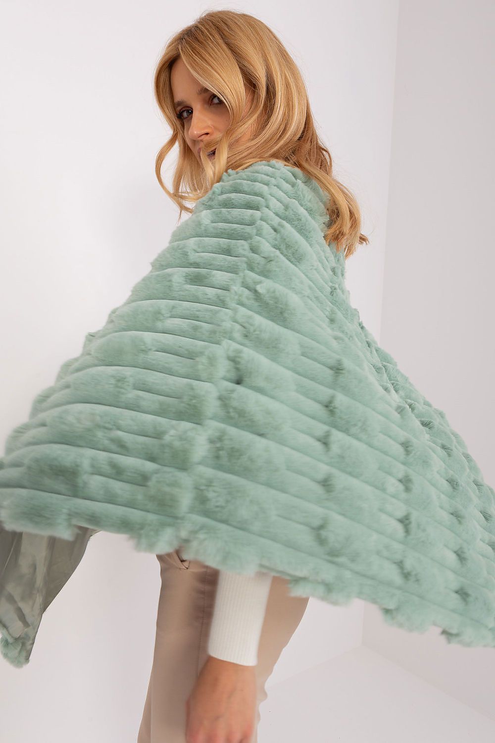 green poncho back view