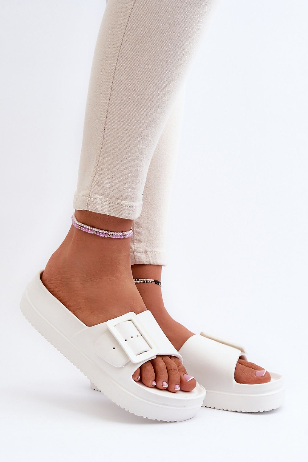 white flip-flops front view