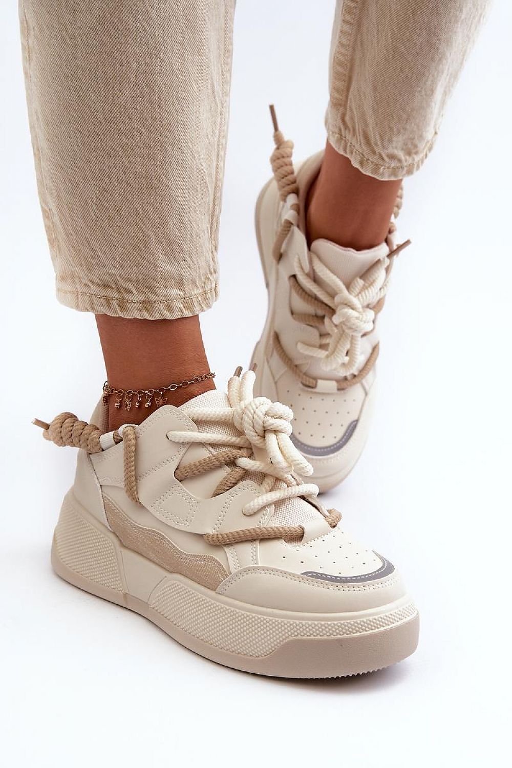 beige sport shoes detail view
