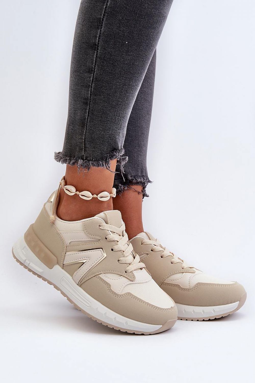 beige sport shoes front view