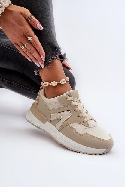 beige sport shoes detail view