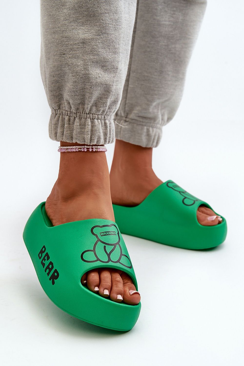 green flip-flops front view