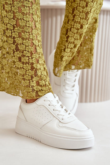 white sport shoes front view