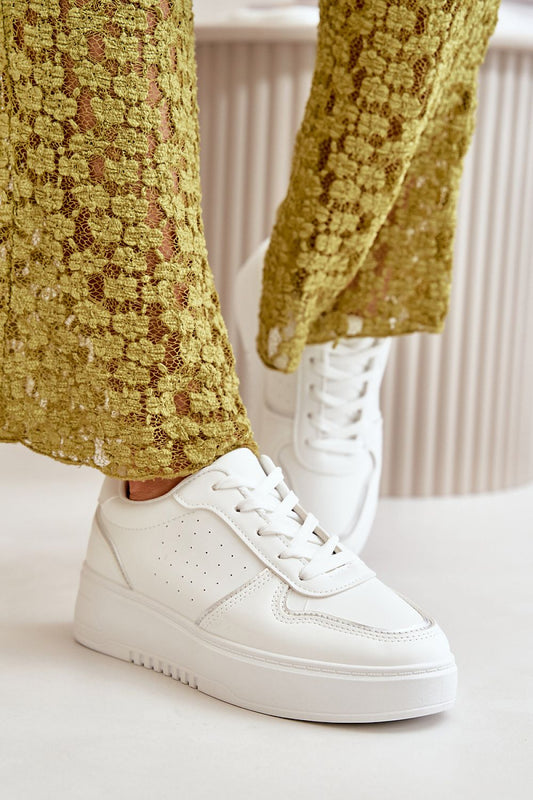 white sport shoes front view