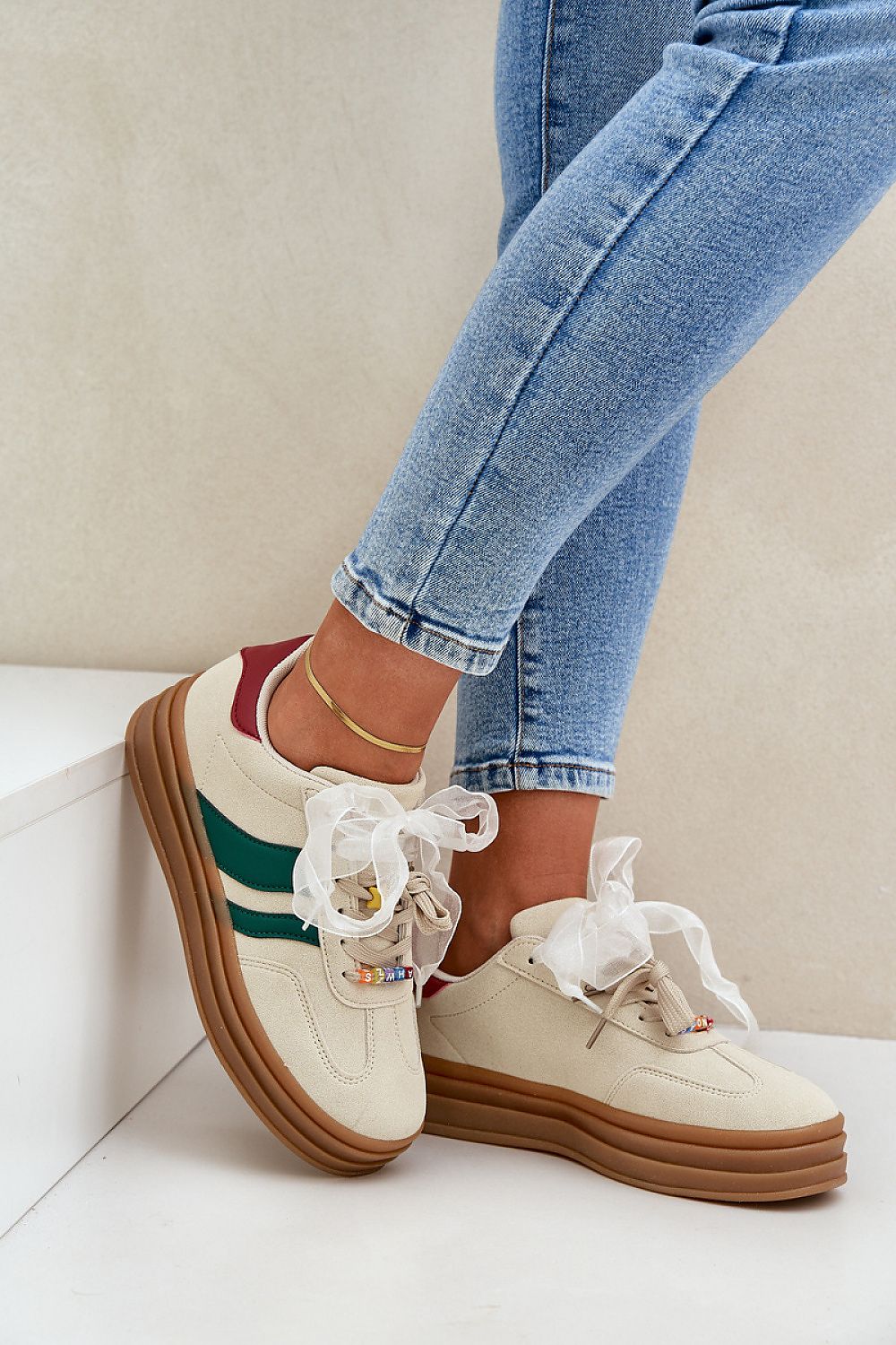 beige sport shoes front view