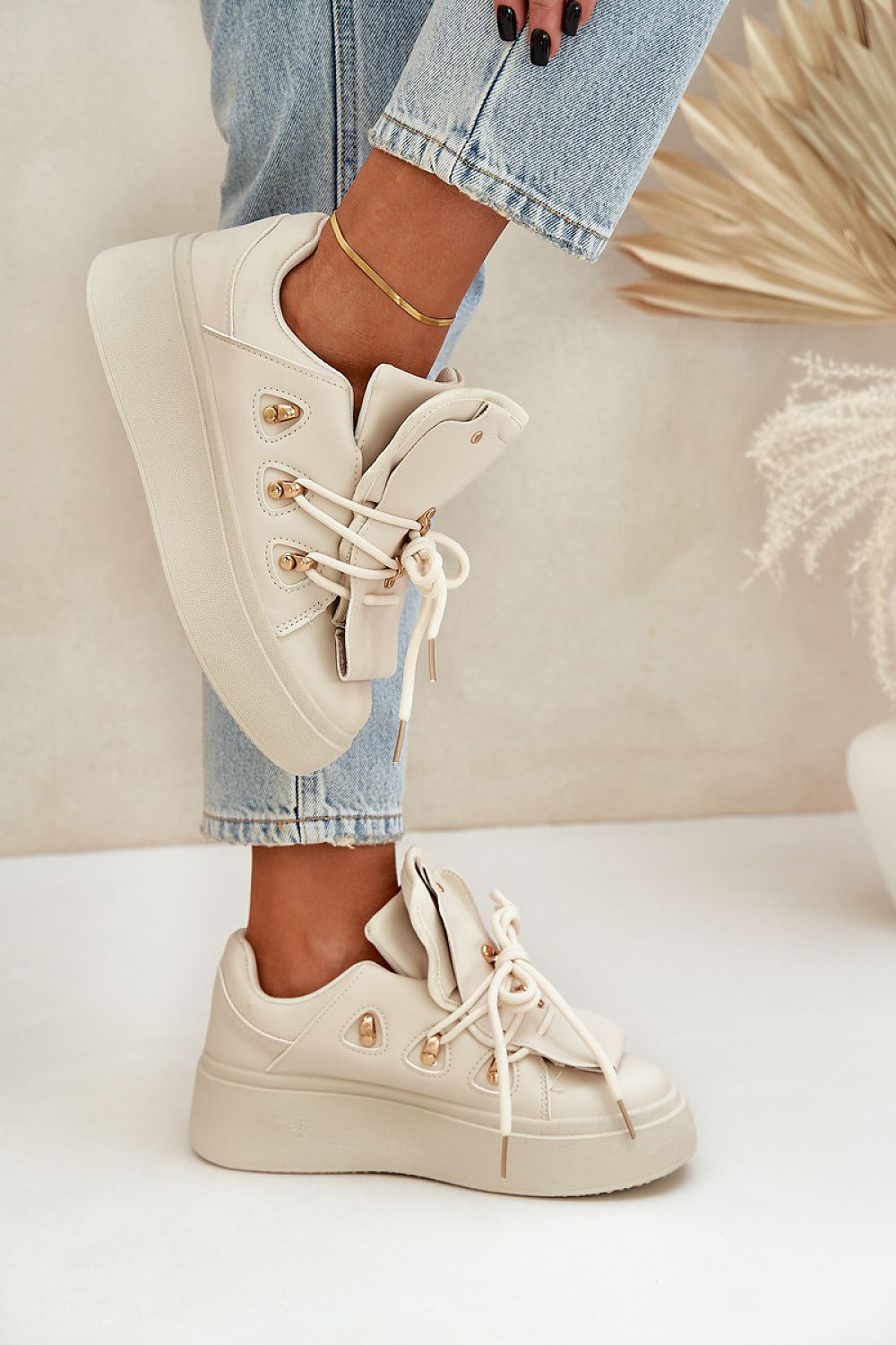 beige sport shoes detail view