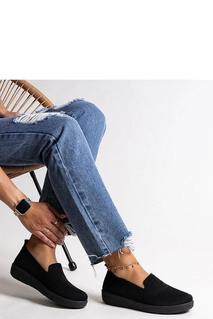 black sneakers front view