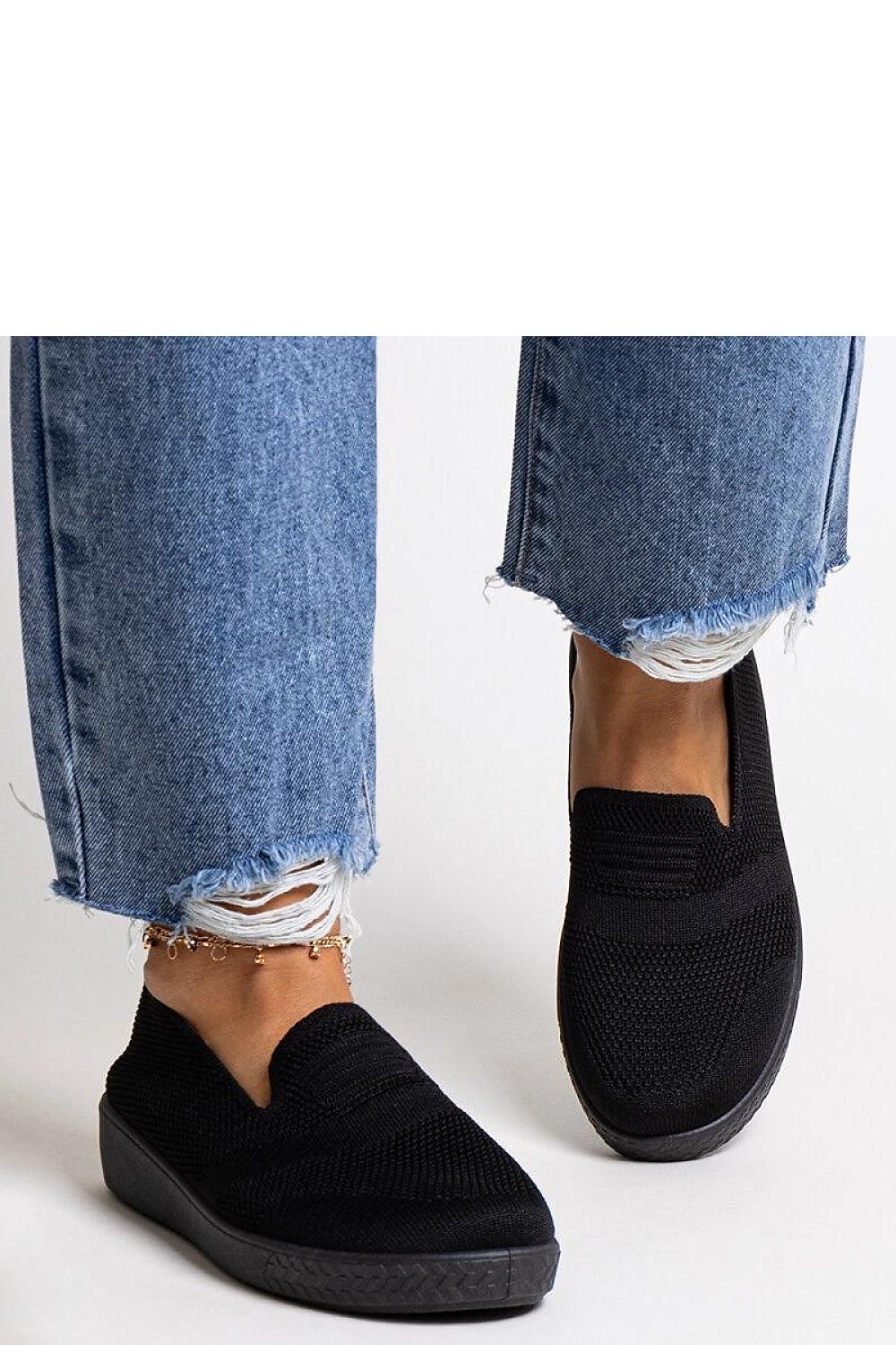 black sneakers back view