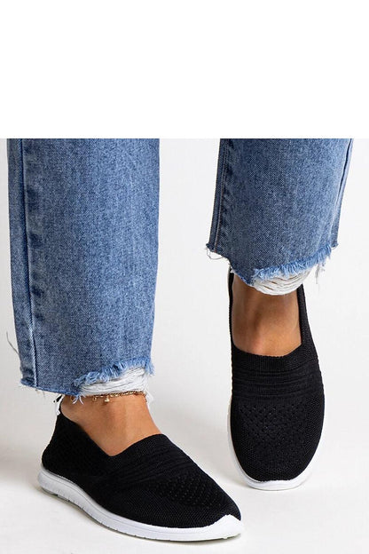 black sneakers back view