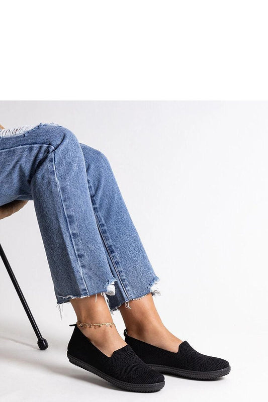 black sneakers front view