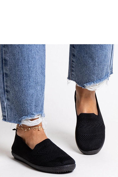 black sneakers back view