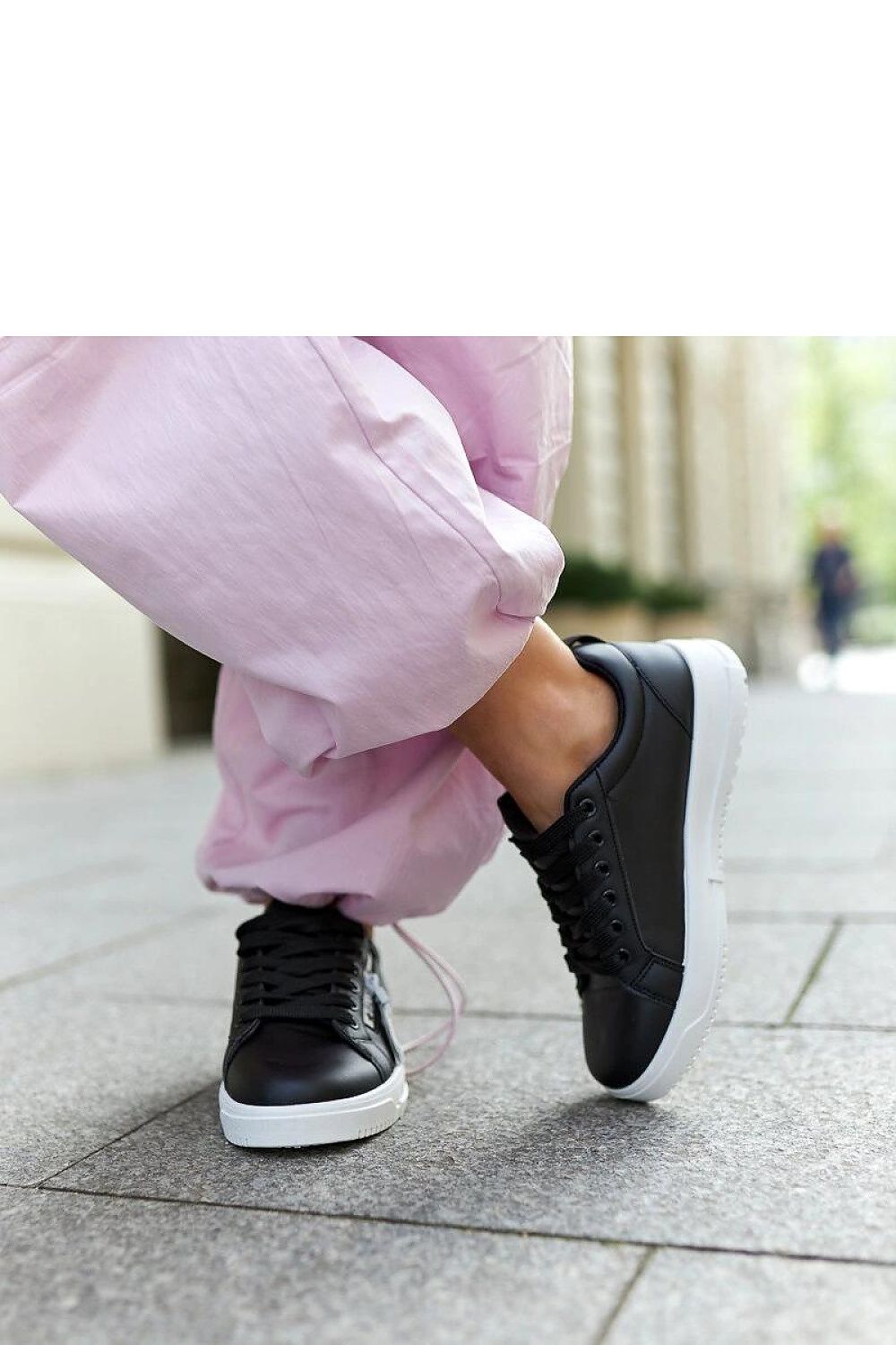 black lace sneakers detail view