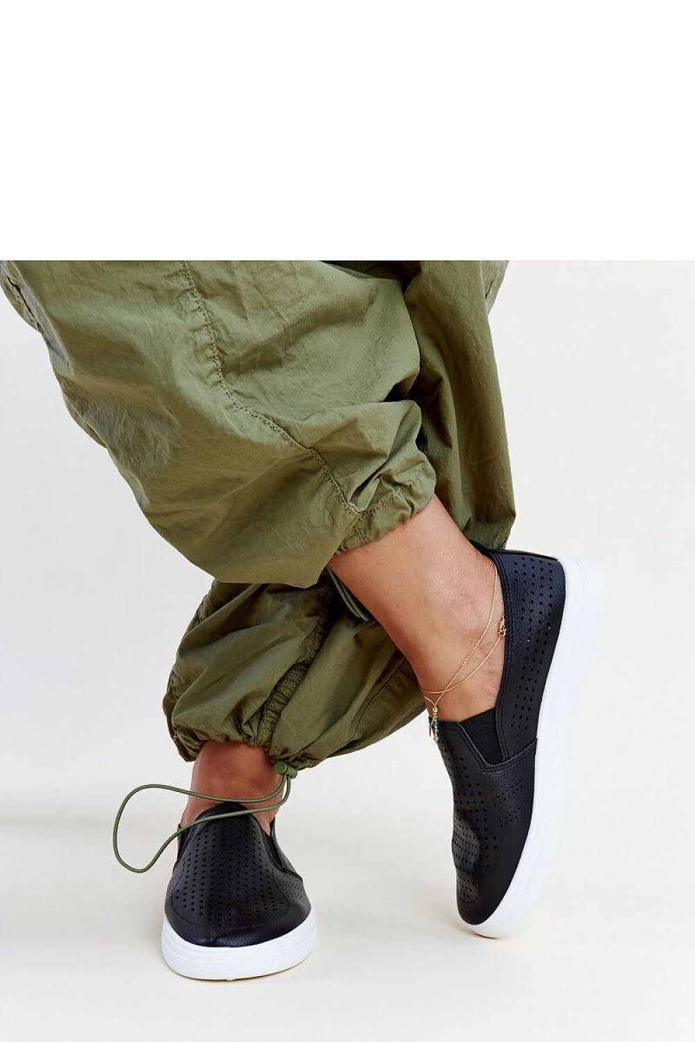 black lace sneakers detail view