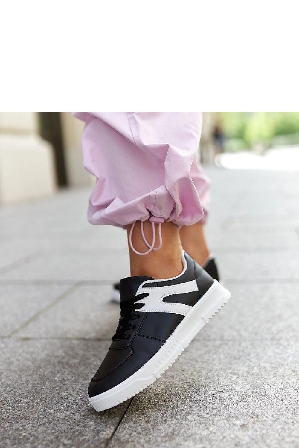 black lace sneakers detail view