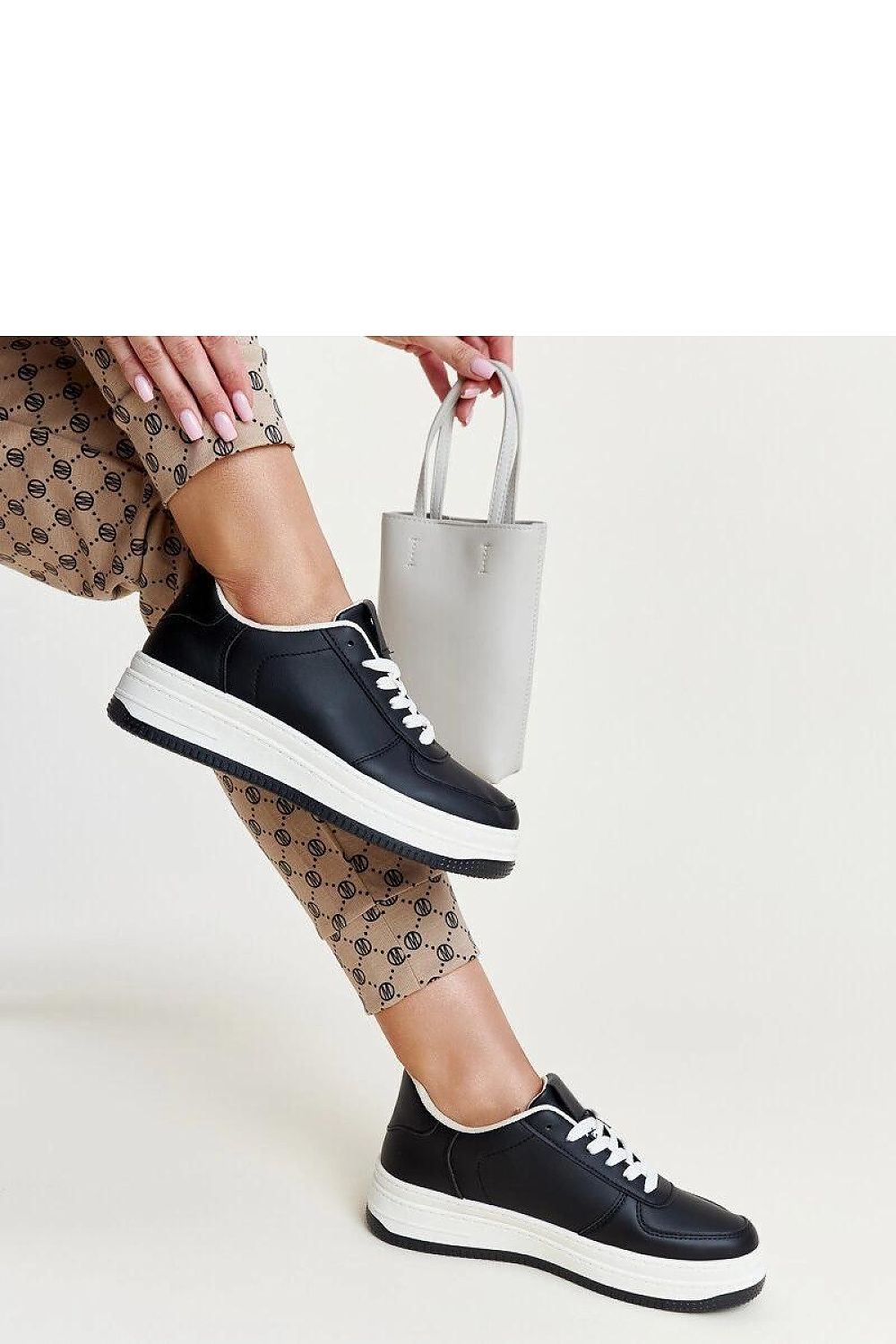 black lace sneakers detail view