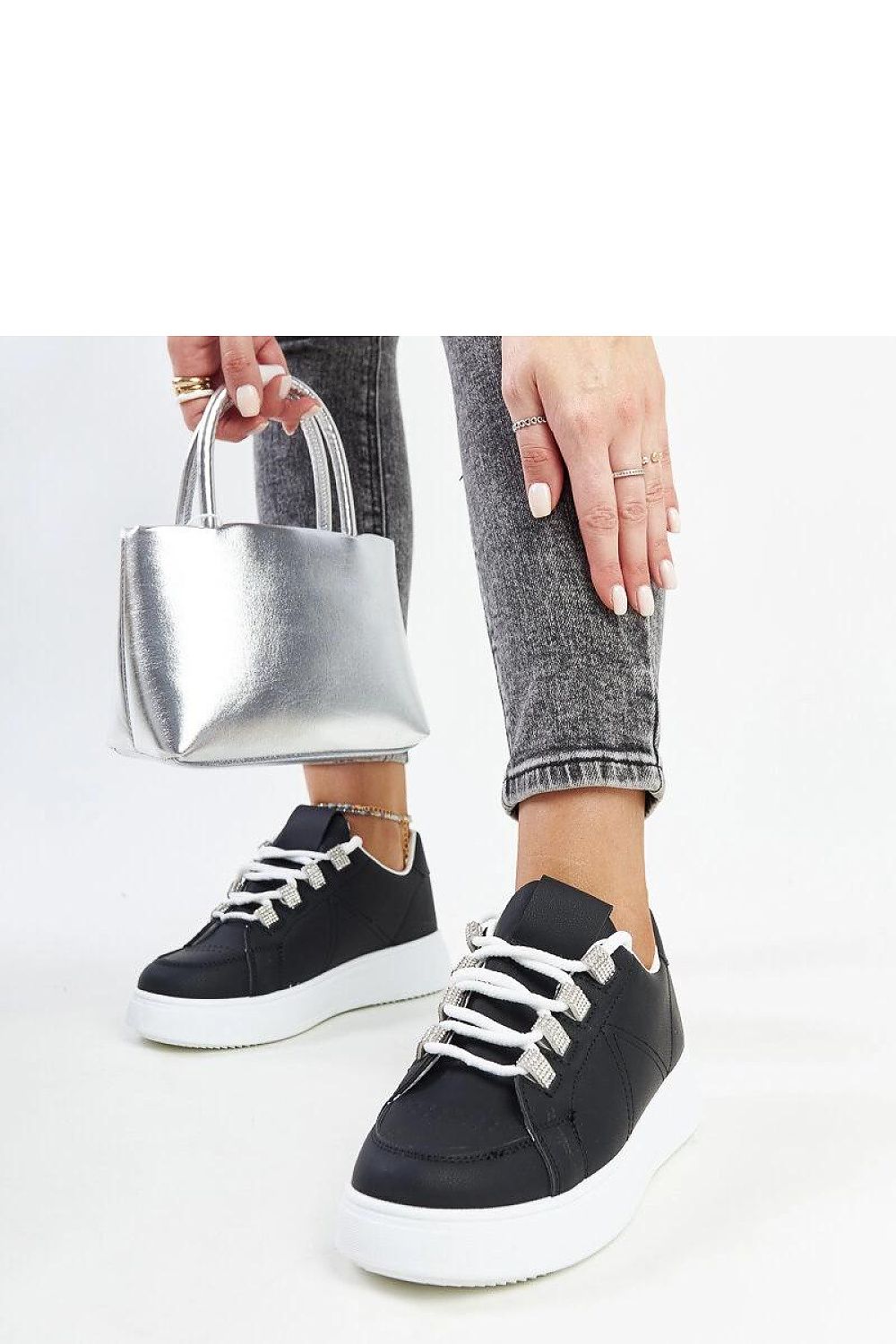 black lace sneakers detail view