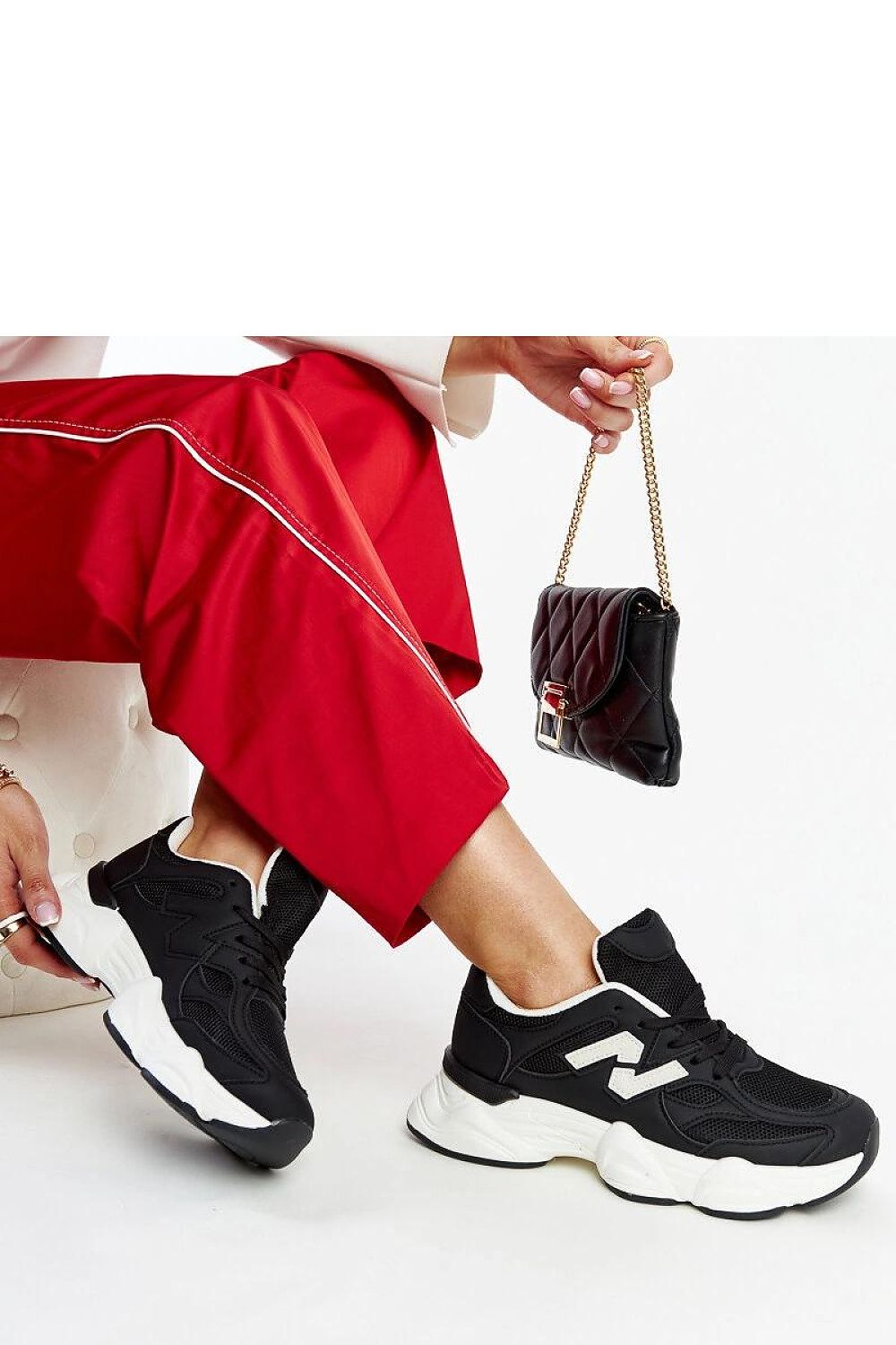 black lace sneakers detail view