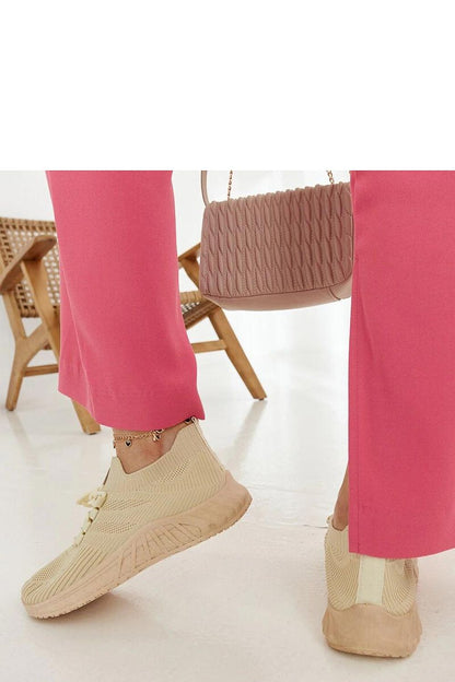 beige sneakers back view