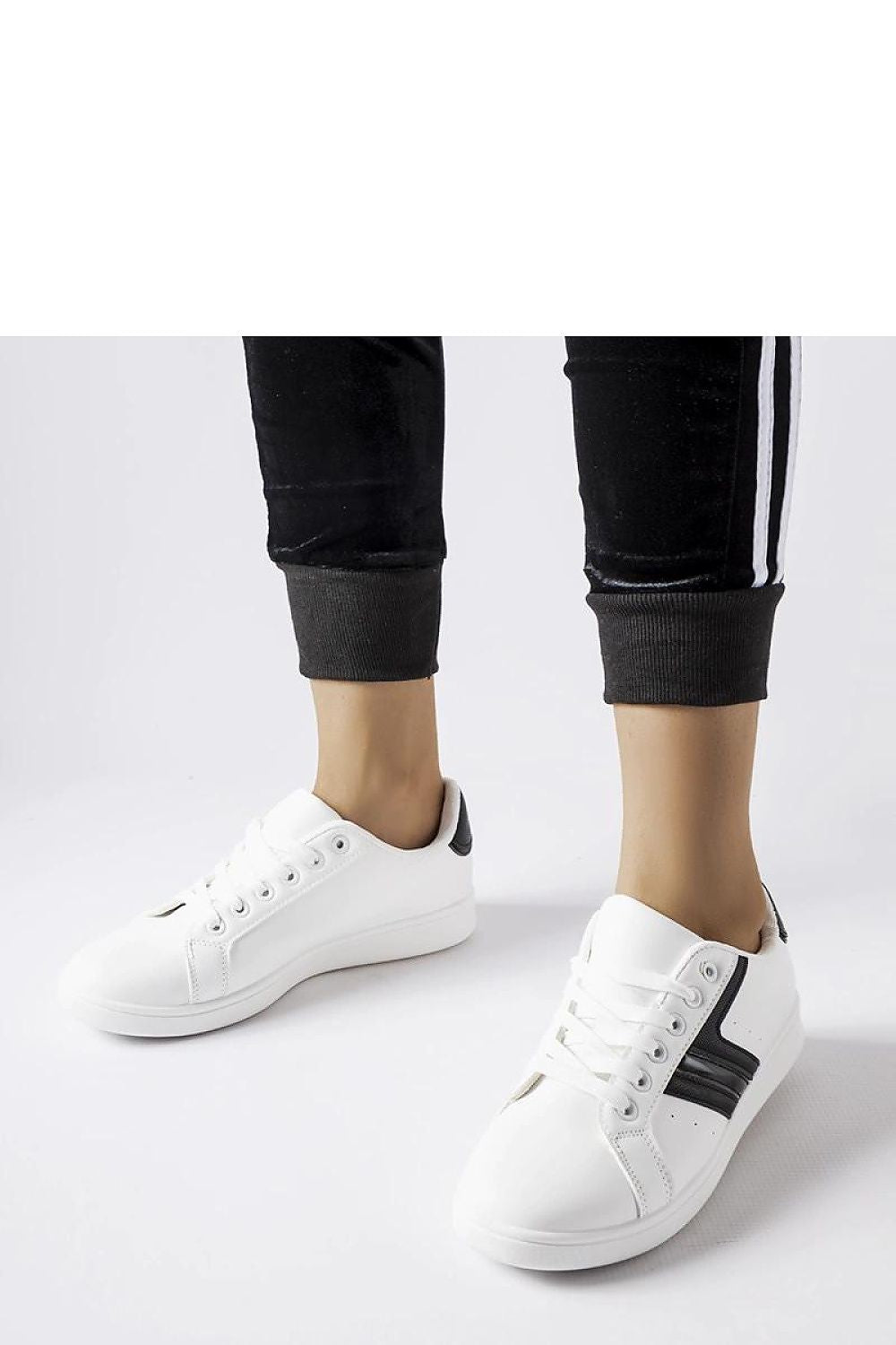 white sport shoes front view