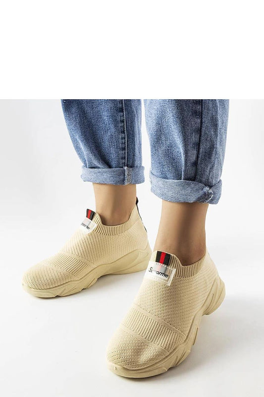 beige sport shoes front view