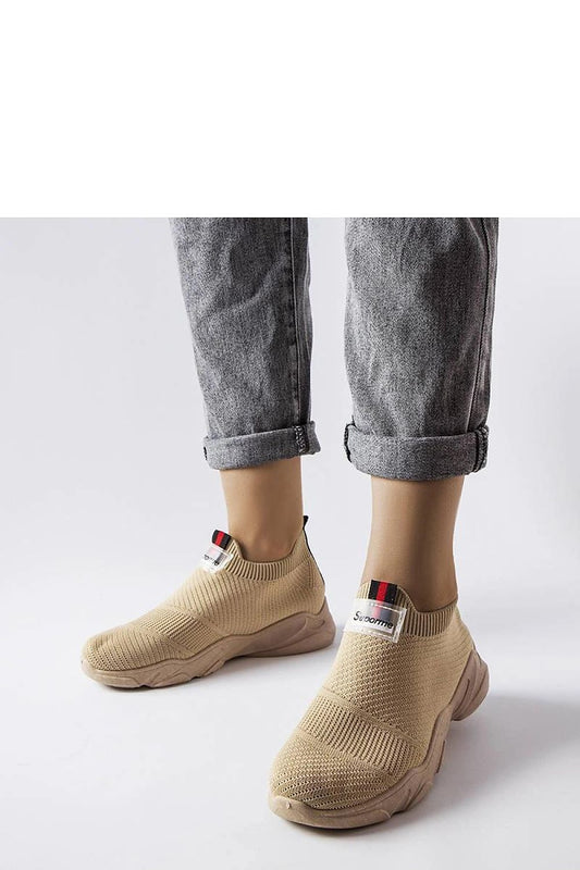 beige sport shoes front view