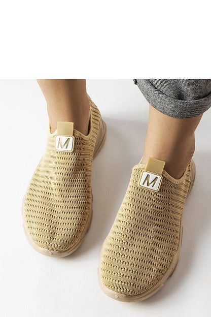 beige sport shoes detail view