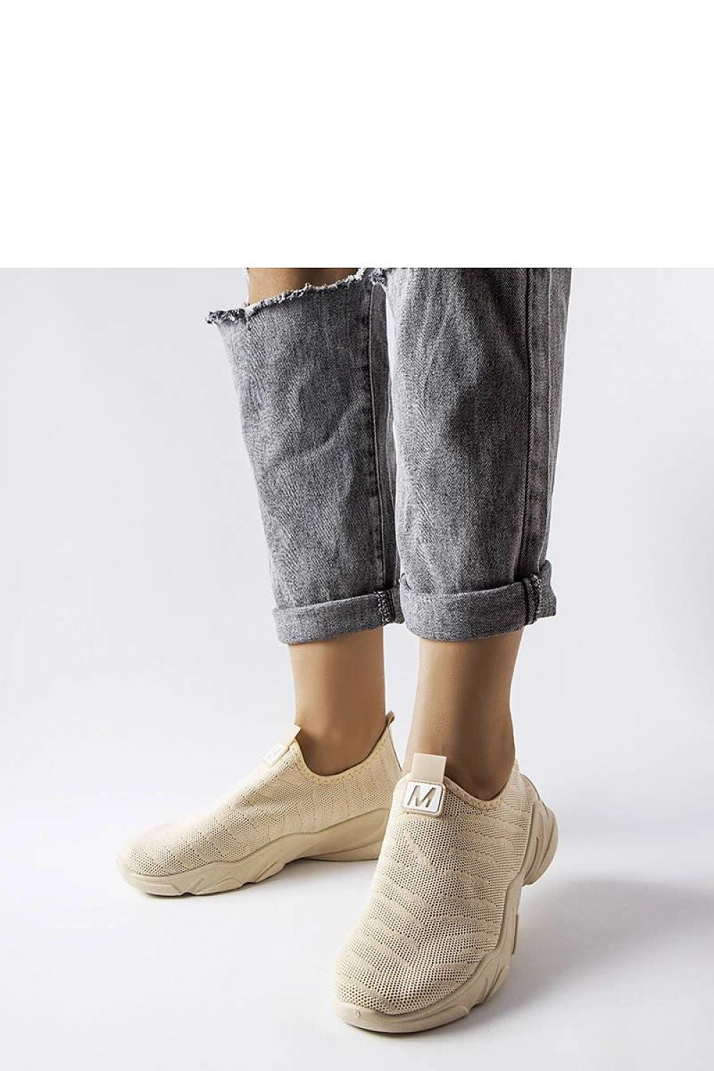 beige sport shoes front view