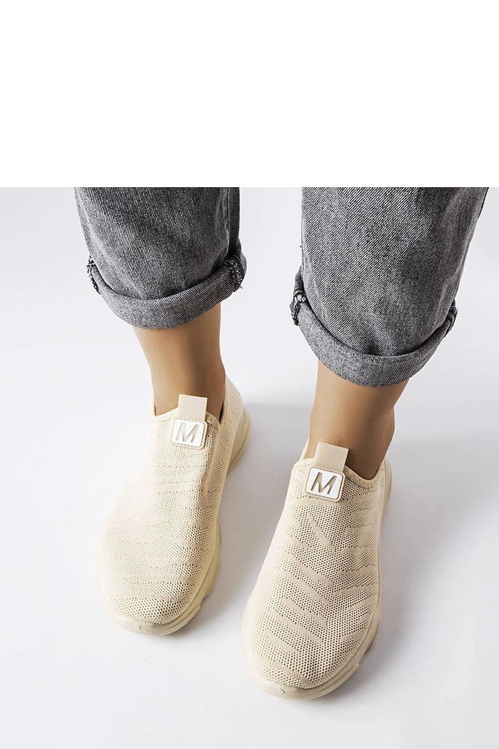 beige sport shoes detail view