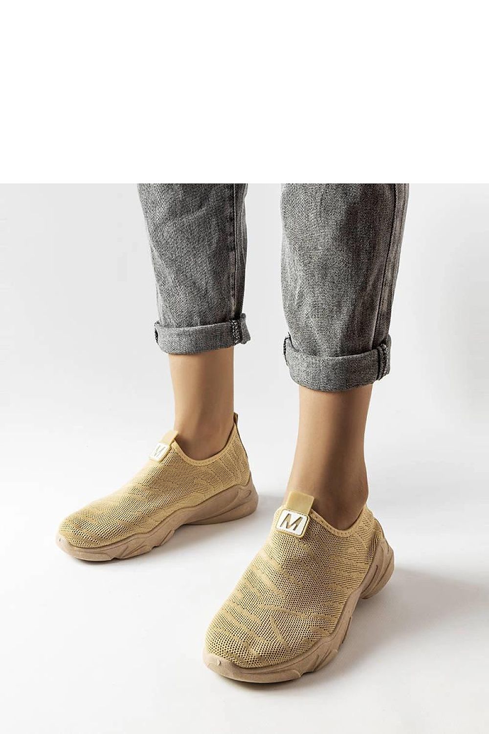 beige sport shoes front view