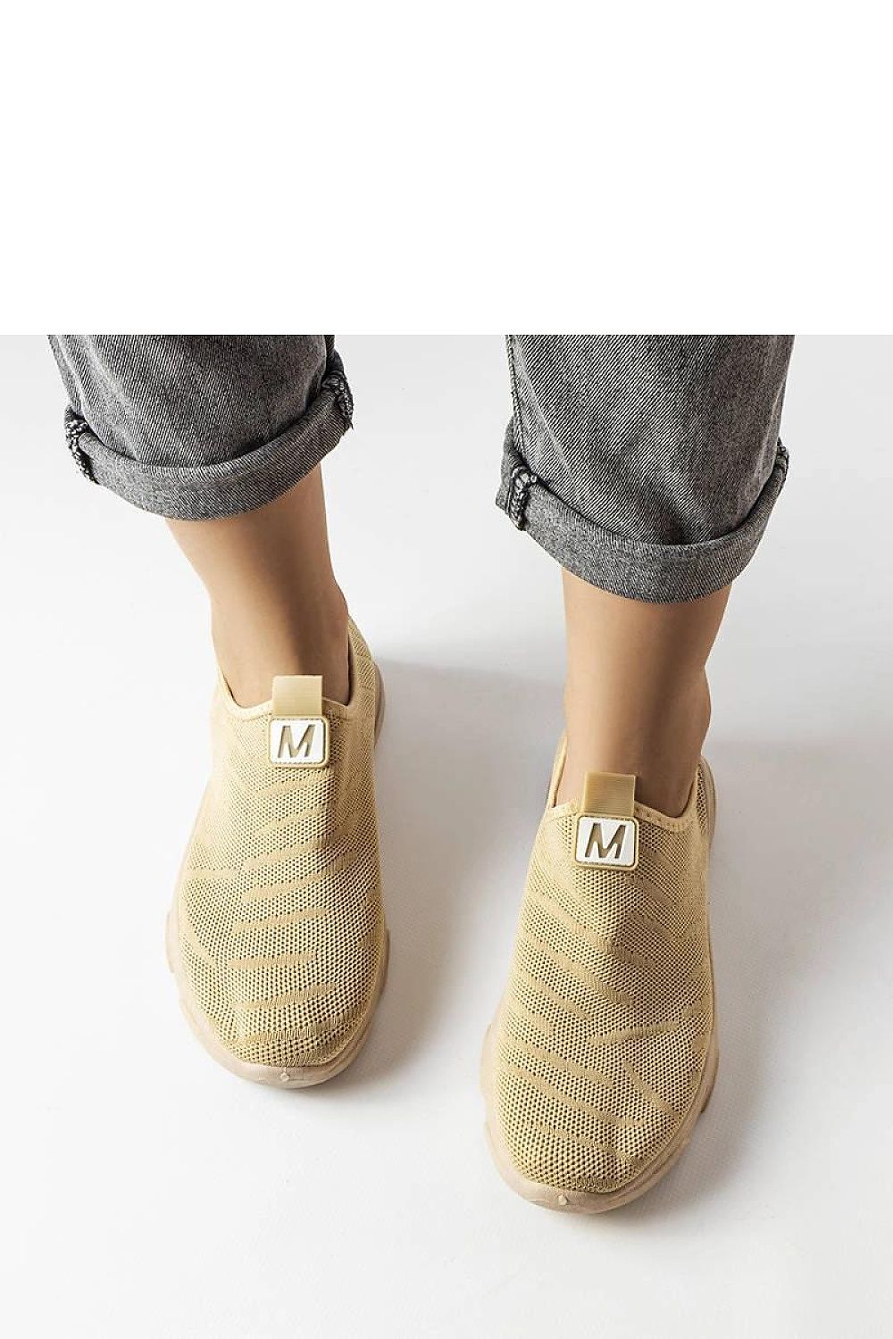 beige sport shoes detail view