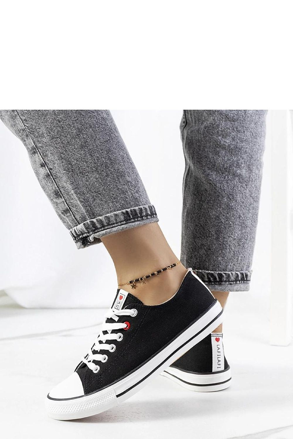 black lace sneakers detail view