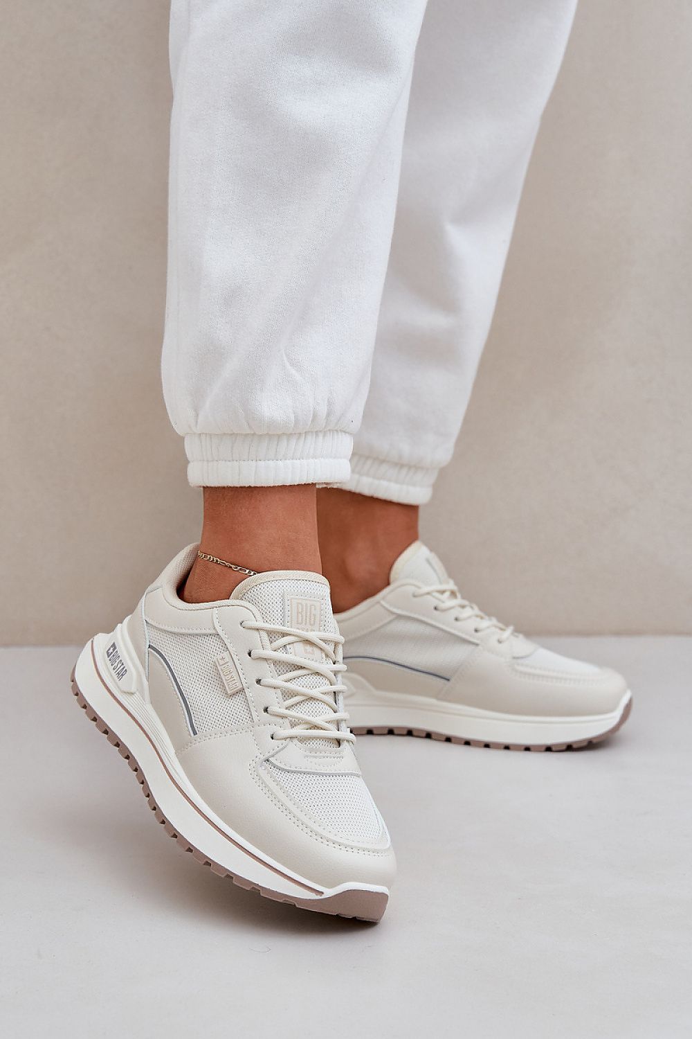 beige sport shoes front view