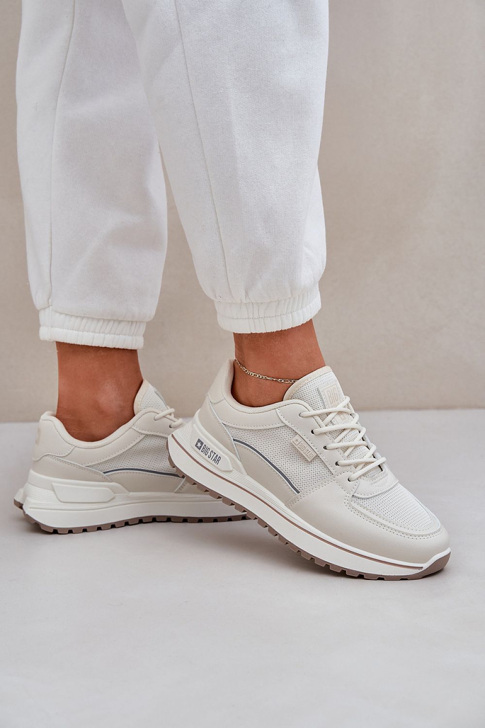 beige sport shoes detail view