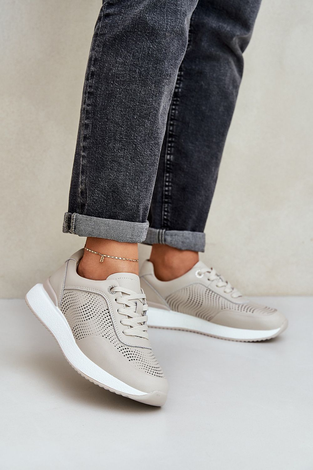 beige sport shoes front view