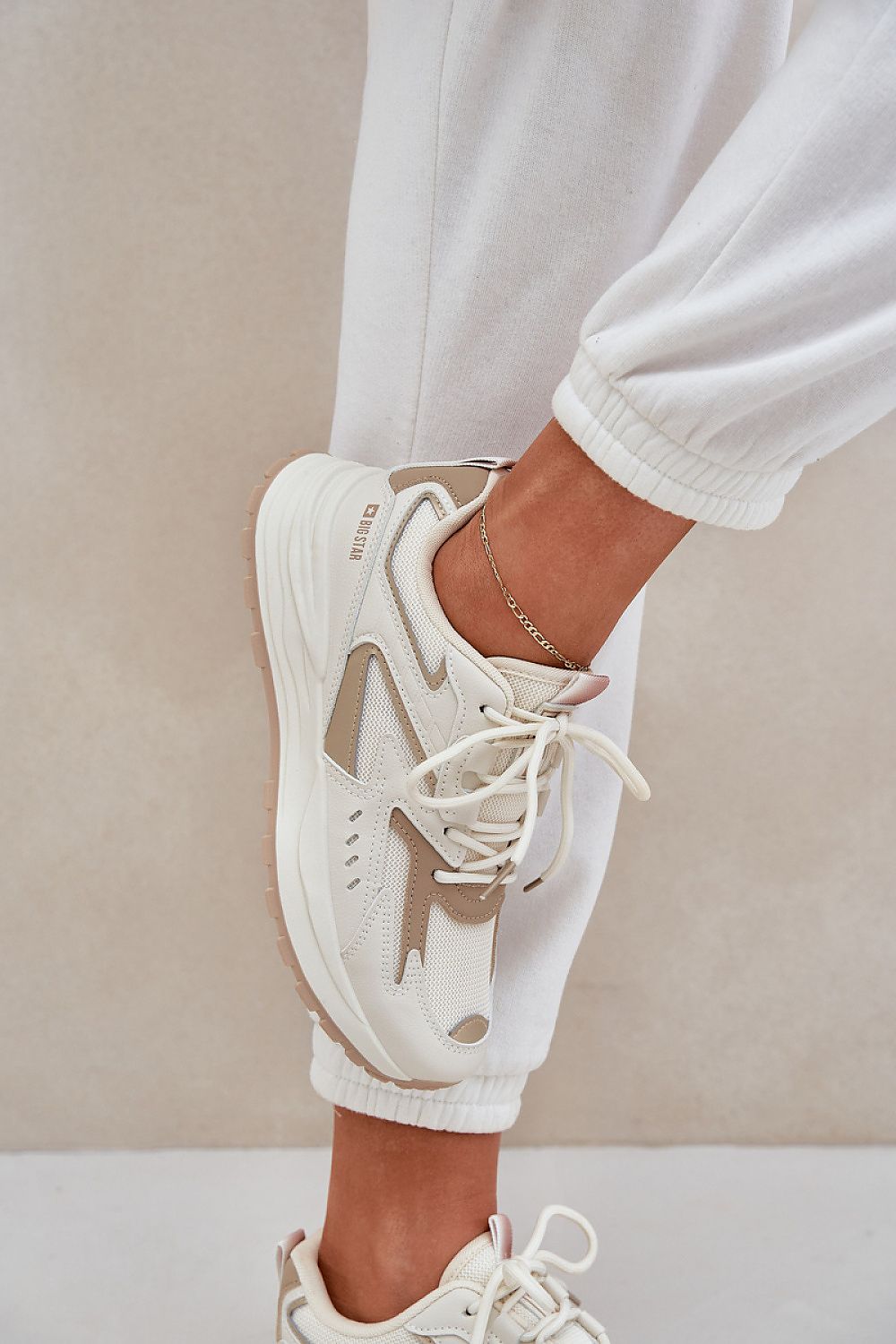 beige sport shoes detail view