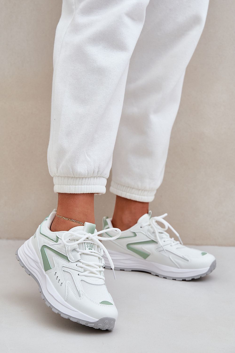 beige sport shoes back view