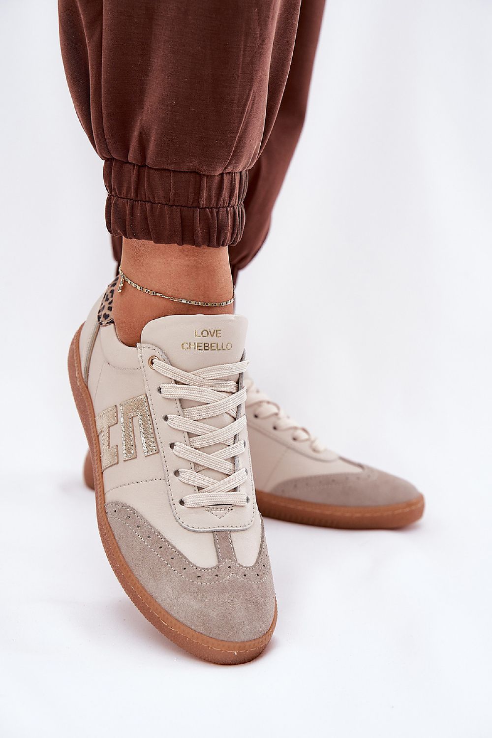 beige sport shoes detail view