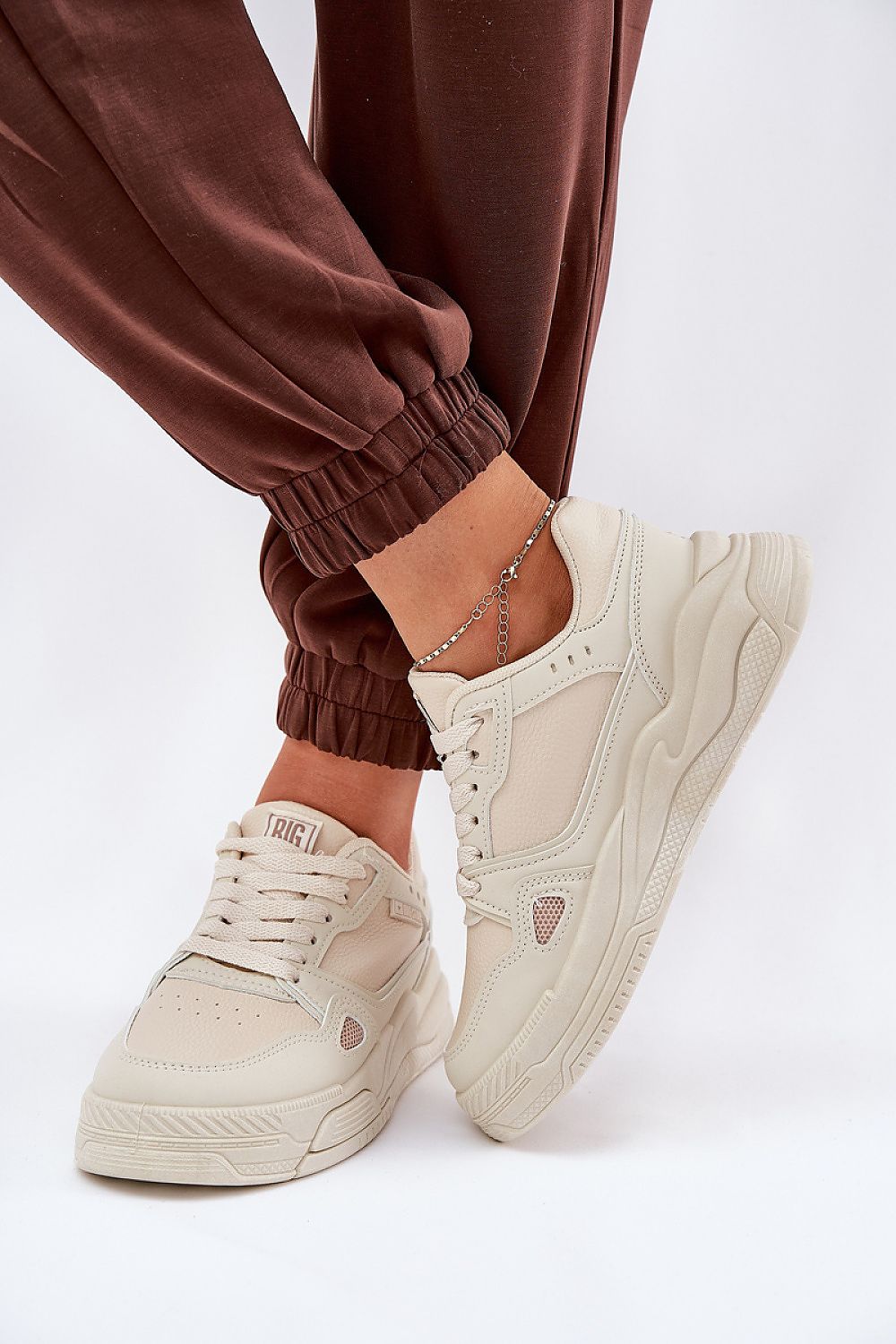 beige sport shoes front view